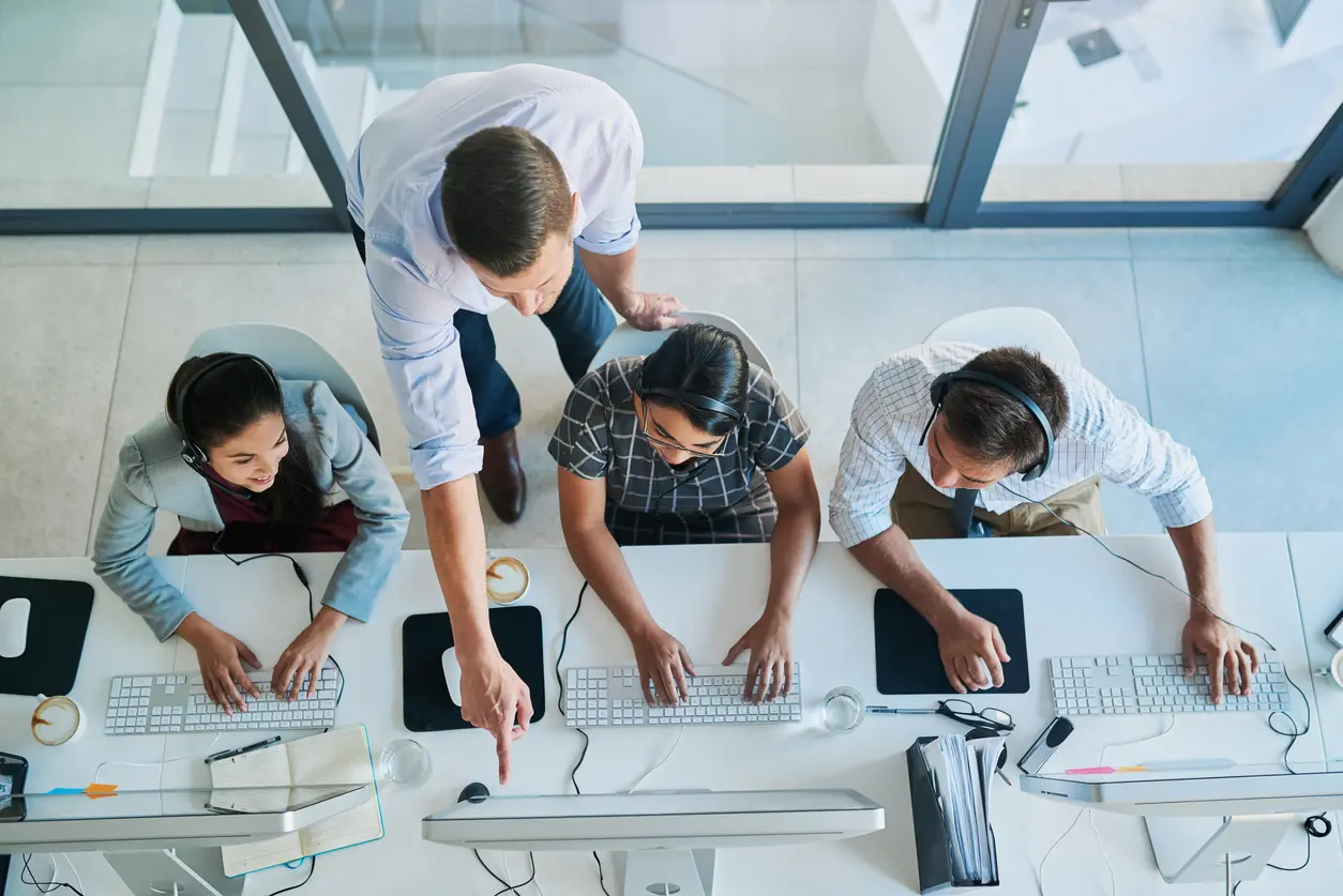 Quality customer service is a team effort team working on computers