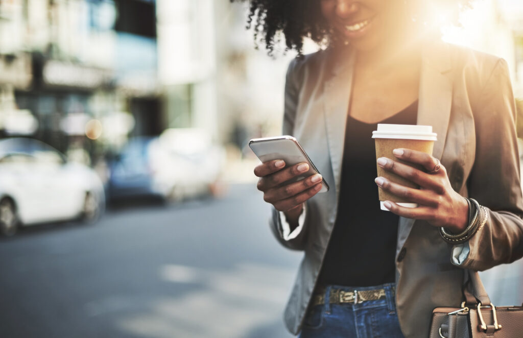 Just grabbed a coffee and coming to the office now Closeup shot of a businesswoman using a cellphone in the city
